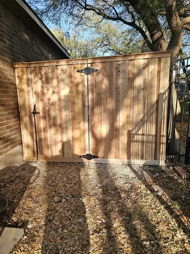 A large finished concrete slab with clean formed edges on a cleared lot